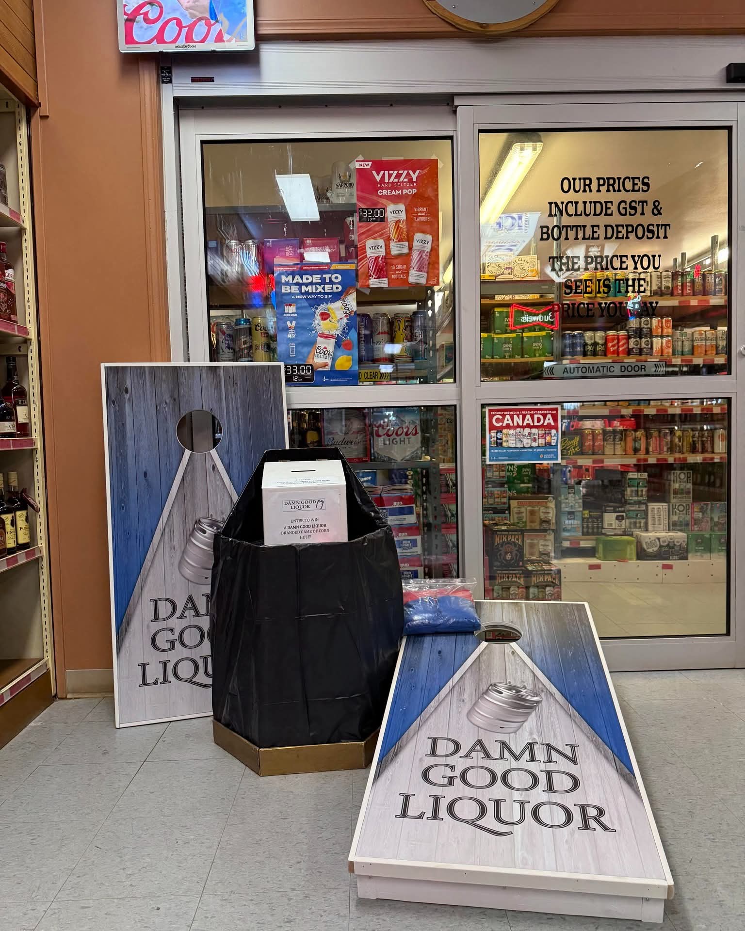 Damn Good Liquor branded cornhole boards in store